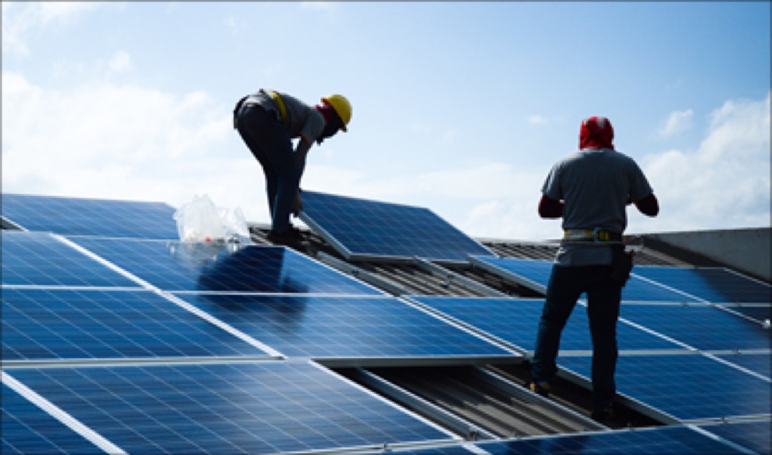 Crown Solar team installing solar panels on a rooftop